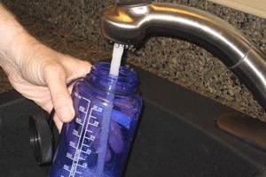 filling water bottle