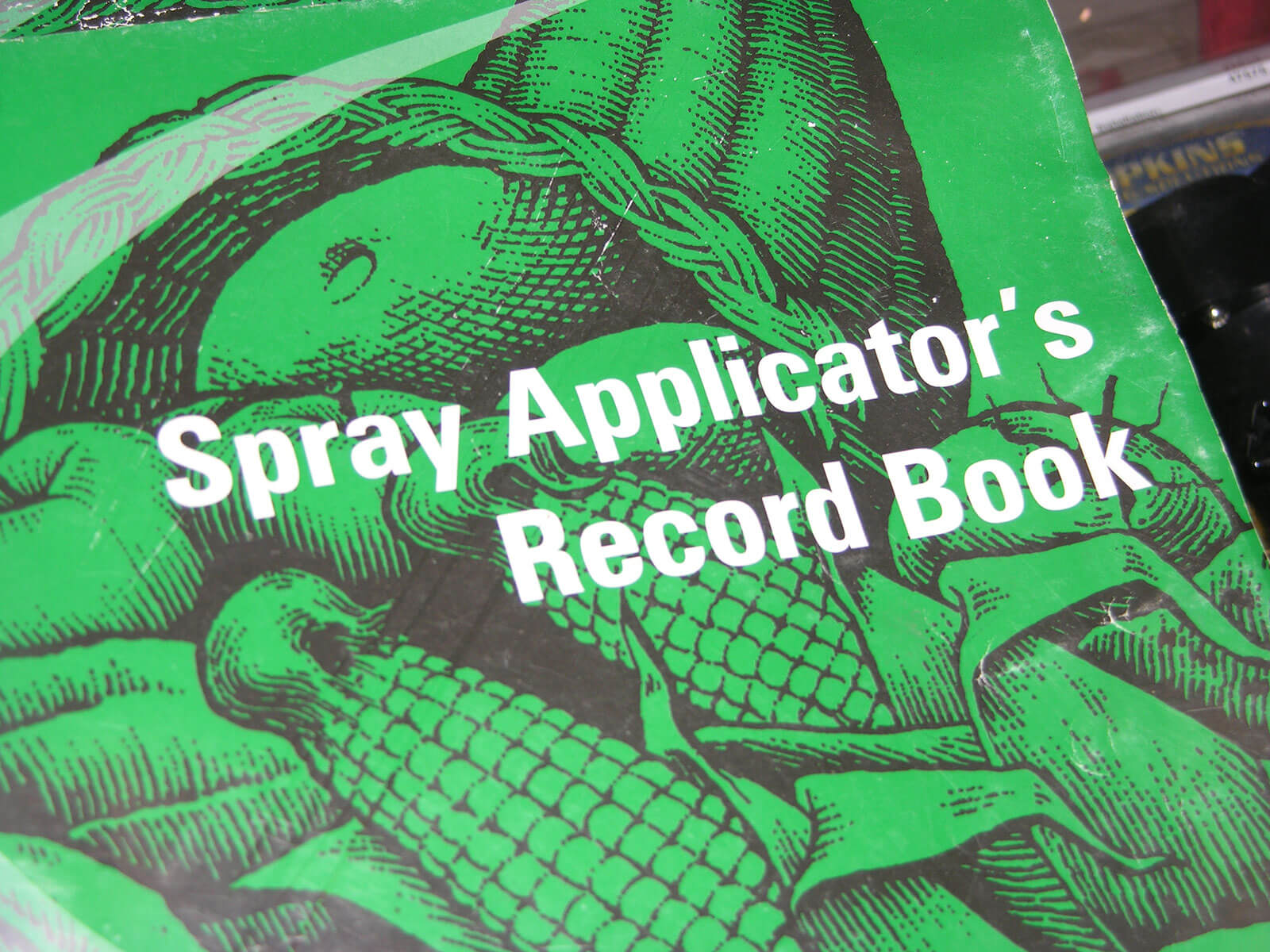 Image of a pesticide spray applictors recordkeeping book. 