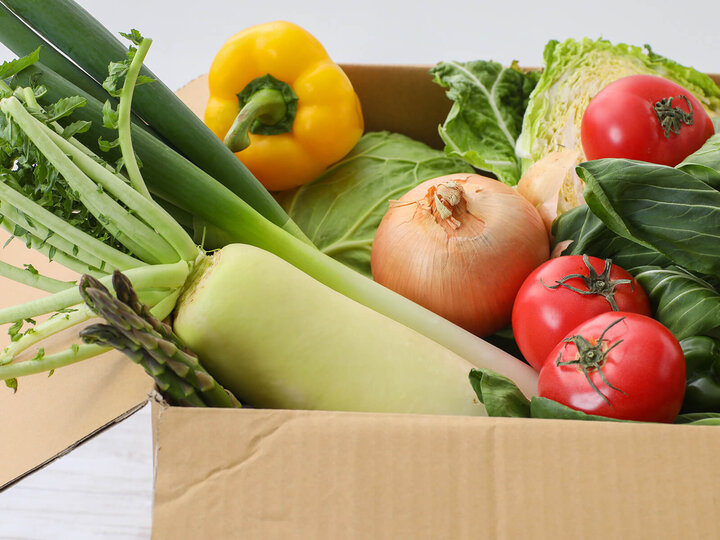 Image of vegetables in a donation box.